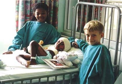 Thobe & Tristan visiting an orphaned burns victim